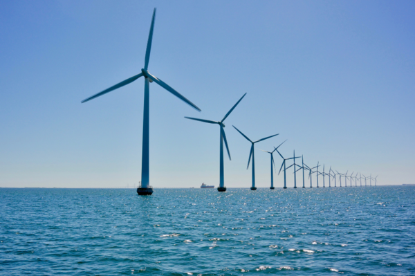 a row of wind turbines placed in the sea